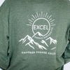 Green sweatshirt with Excel Therapy Services logo, featuring text and mountain illustration.