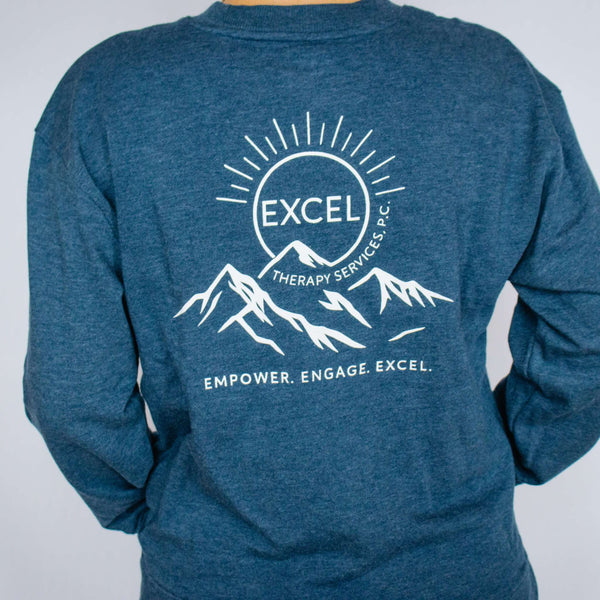 Blue sweatshirt with white Excel Therapy Services logo and text on a plain background